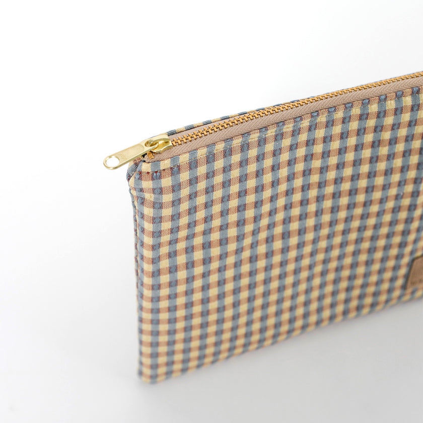 Gold-tone zipper on checked Kara Zip Pouch by Unshattered
