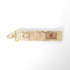 Fabric key clip with a gold clasp on a white background