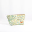 Cosmetic bag with floral pattern on a white background
