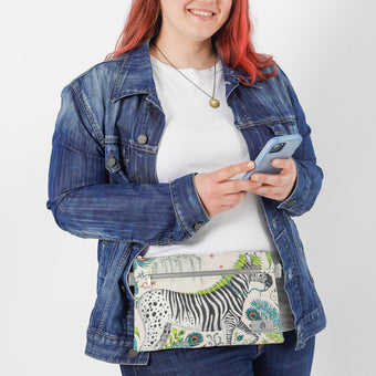A woman handsfree wearing a Multicolored 3-in-1 bag with zebra design  named after Chivon 