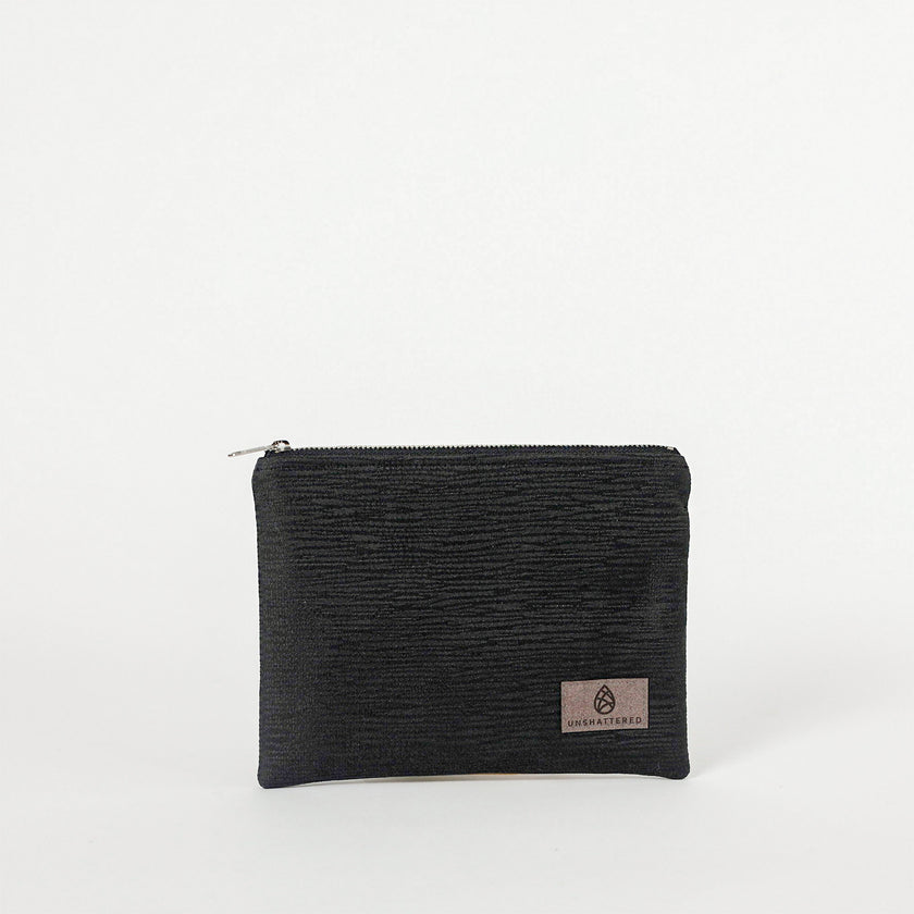 Black zippered pouch with a brand logo on a white background
