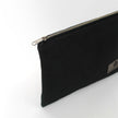 Black zippered pouch on a white background named after Harmony 