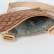 A green shiny fabric interior with a gold seam and a gold tone hardwre