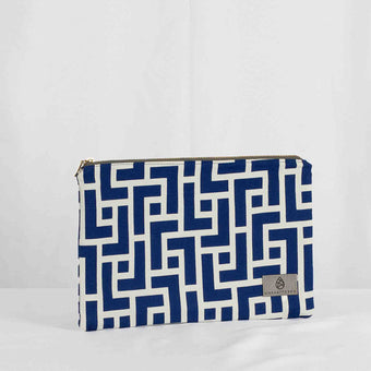 A large zip pouch with a blue and white geometric pattern and gold-tone hardware, displayed against a white background.
