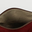 A light brown luxury leather alternative interior on a burgundy floral pattern makeup bag named after Alaney 