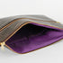Purple fabric interior of brown 3-in-1 bag can be seen on a white background