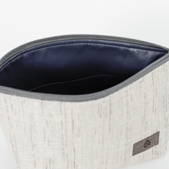 A dark blue luxury leather alternative interior on a white two twill weave on exterior named after Josey 