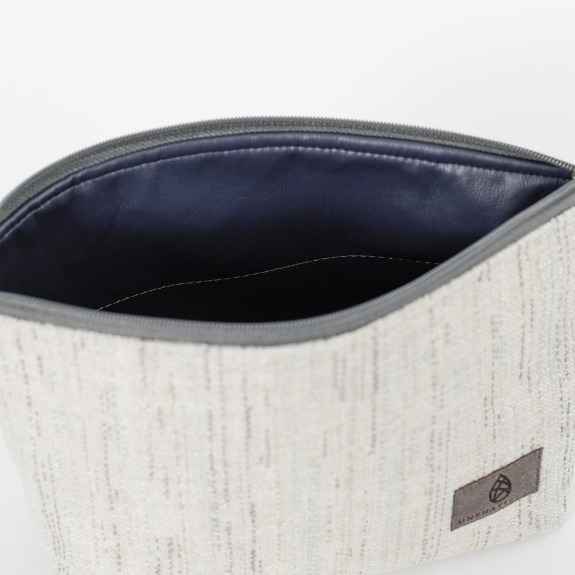 A dark blue luxury leather alternative interior on a white two twill weave on exterior named after Josey 