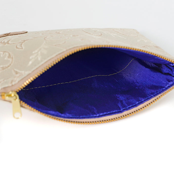 Blue fabric interior of zippered pouch named in honor of Kathleen handcrafted by the artisans at Unshattered