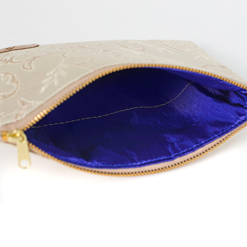 Blue fabric interior of zippered pouch named in honor of Kathleen handcrafted by the artisans at Unshattered