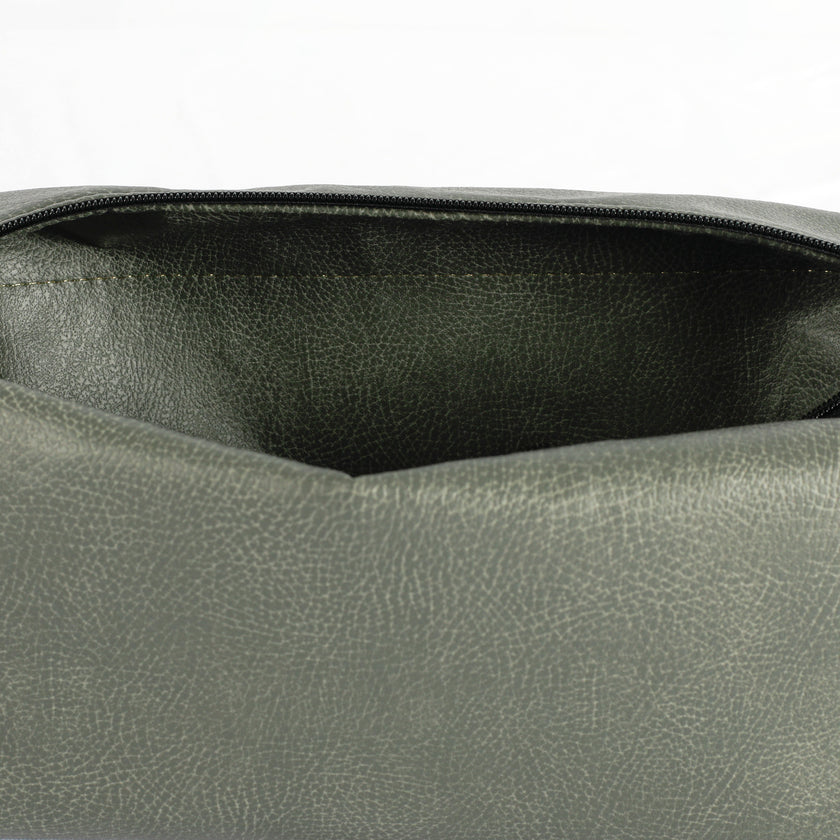 Interior of a gray luxury leather alternative toiletry bag