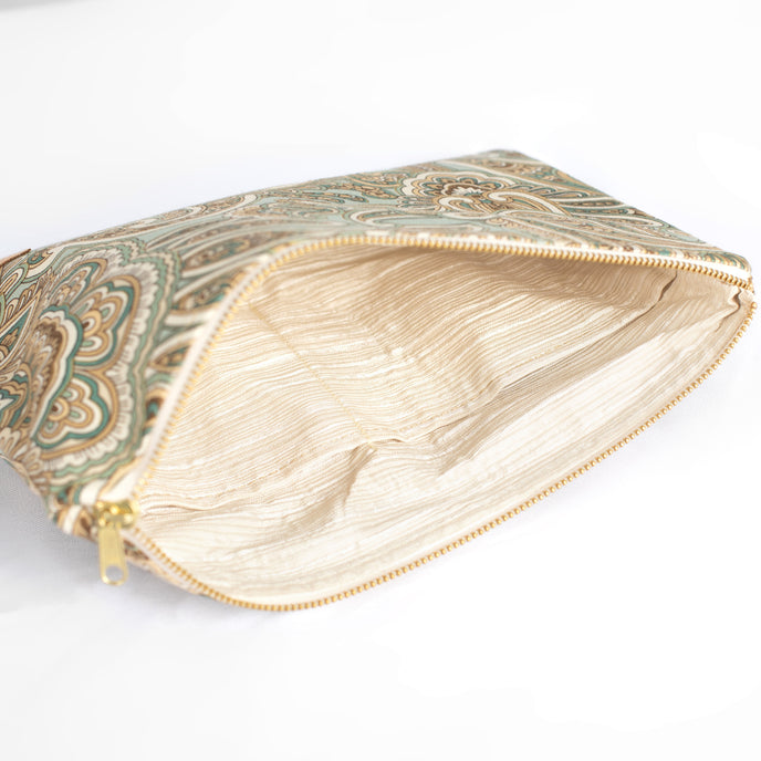 Zipped pouch with paisley pattern on a white background