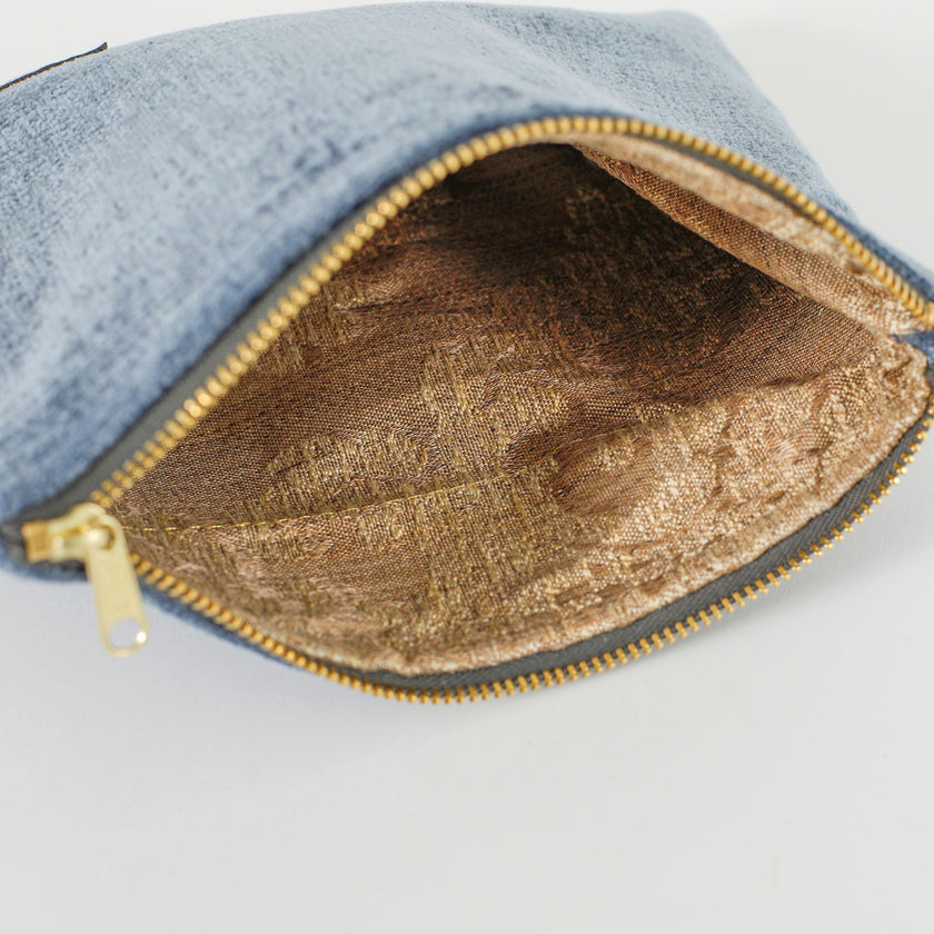 A flower pattern interior brown and yellow with a gold zipper named after Angie.