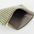 Gray luxury leather alternative interior of a green zippered pouch