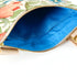 A bright blue interior on a floral crossbody bag named after Leanna.