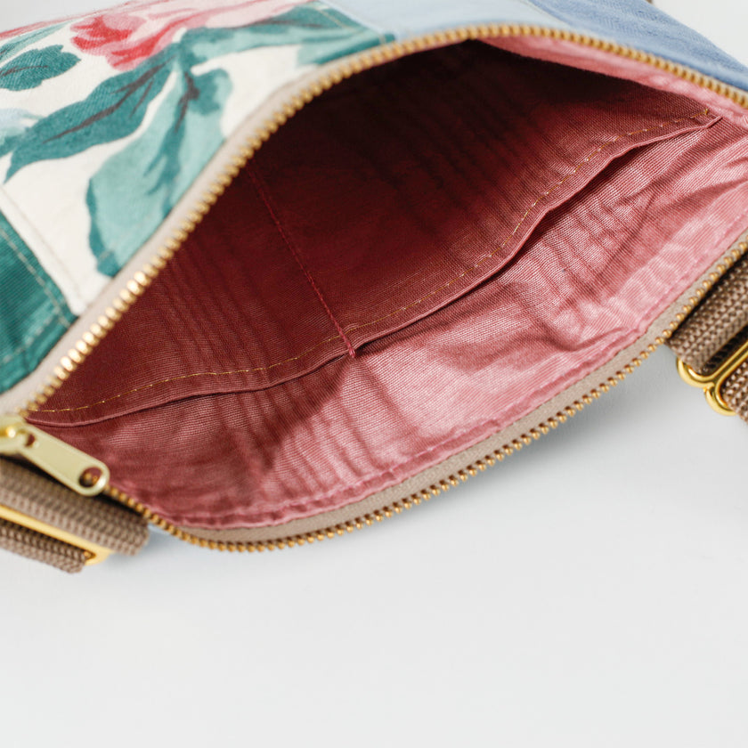 A pink interior of a multi-panel flower crossbody pouch named after Nadiya 