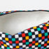 Close-up of a colorful checkered pattern with white wipe-clean interior on a white background named after Lyddin 
