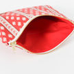 Red interior  with red and white pattern and gold zipper on a white background named after Neena 