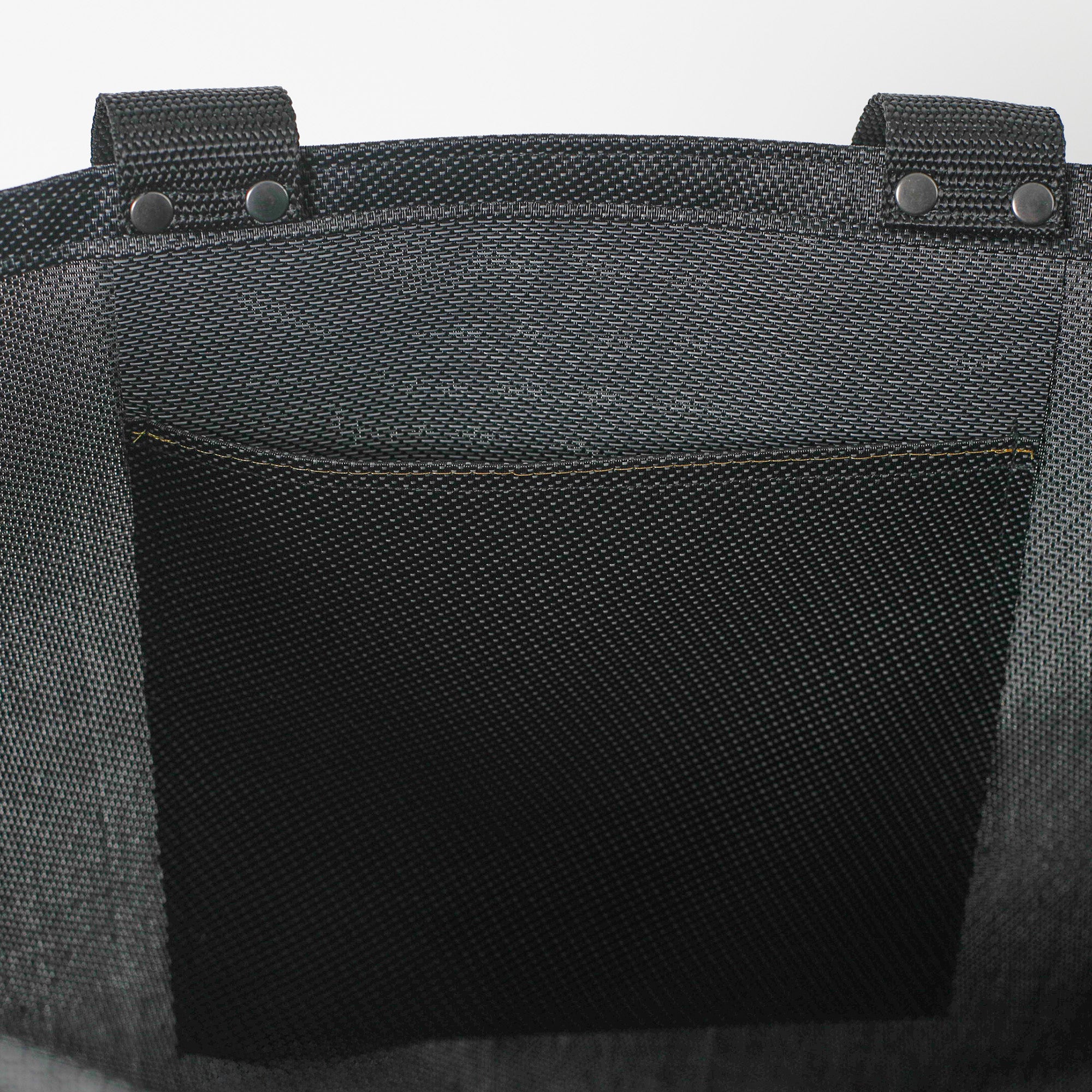 Interior pocket of black shopper
