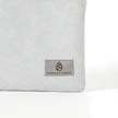 A gray label on a silver luxury leather alternative fabric pouch bag named after Irene