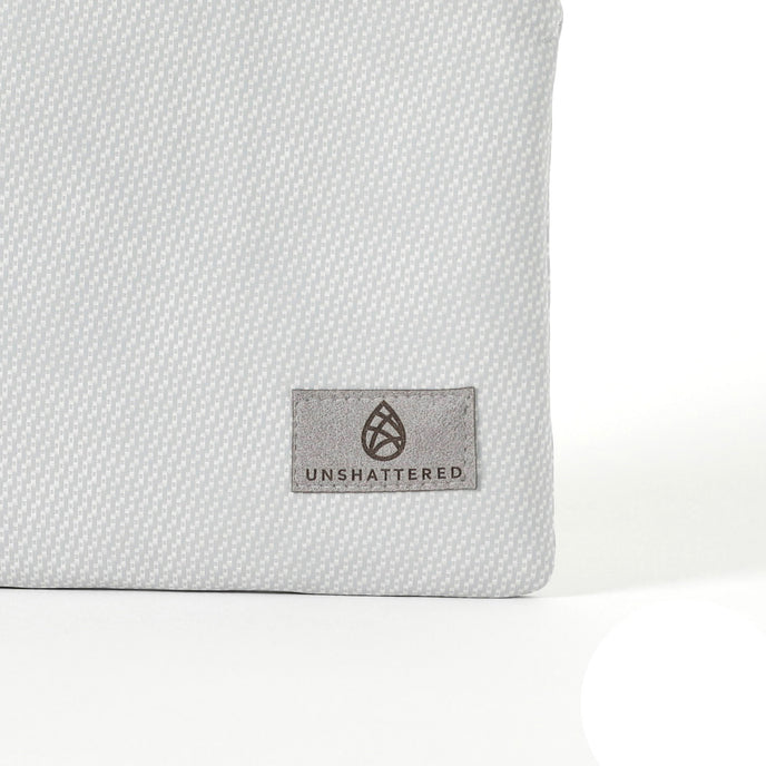 A gray label on a silver luxury leather alternative fabric pouch bag named after Irene