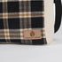 Plaid-patterned bag with 'Unshattered' brand logo on a white background named after Jeanne
