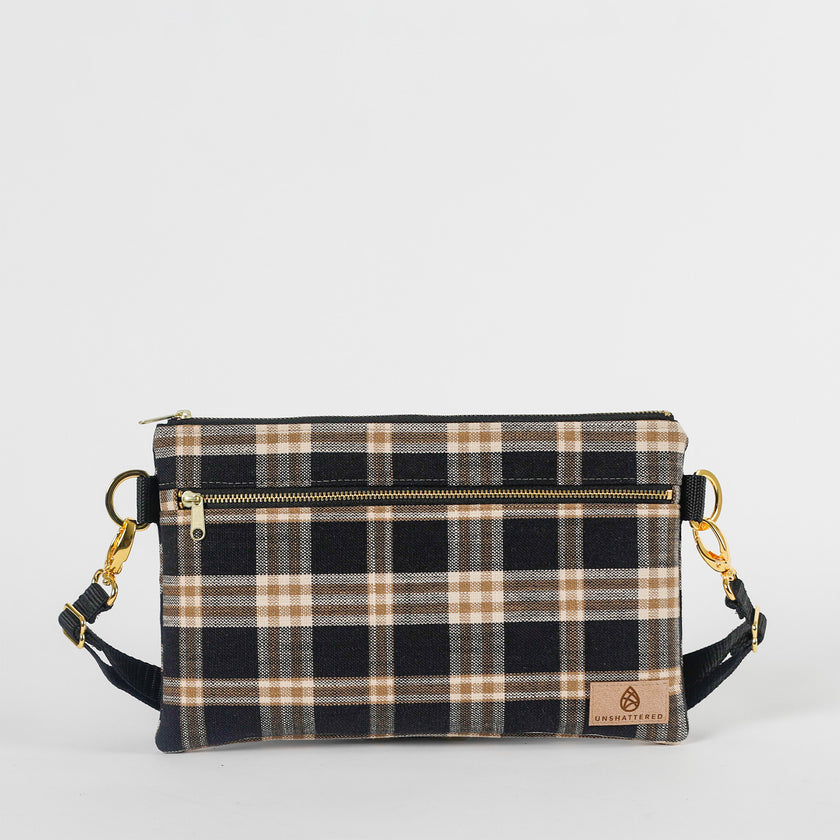 Plaid patterned bag with gold zipper and black straps on a white background named after Jenny