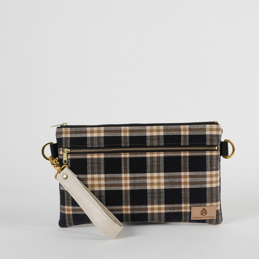 Plaid patterned pouch with a strap on a white background named after Jenny