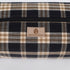 Plaid patterned bag with 'Unshattered' brand logo on a white background named after Jeremiah 