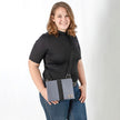 lifestyle shot of dress gray crossbody 