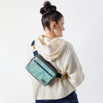 A blue geometric design errand bag with gold hardware named after Kristine 