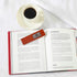 Lifestyle shot of red bookmark 