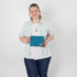 Person holding a blue zip pouch against a white background