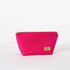 Hot pink makeup kit with a gold zipper and brand label on a white background