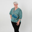 Lifestyle shot of Marielle worn across the chest 