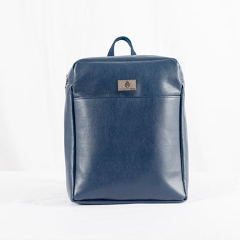 A blue luxury leather alternative backpack with a gray label on a white background