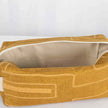 A cream luxury leather alternative material on a yellow line design toiletry kit 