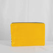 A yellow velvet back of a blue and white design large zip pouch 