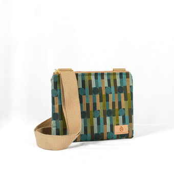 Crossbody bag with geometric pattern and beige strap on a white background named after Nicole 