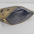 A black interior fabric on this gold large zip pouch with dogs on it and a gold tone zipper 