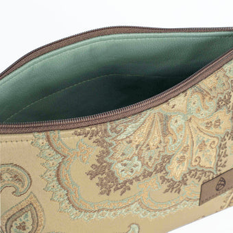 A blue luxury leather alternative material on a beige floral makeup kit 