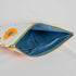 A blue fabric with dots interior on this large white sunflower design zip pouch 