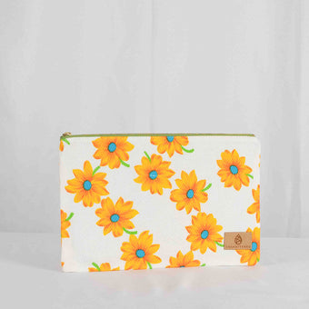 A large zip pouch with a white background and a vibrant floral pattern, featuring yellow flowers with blue centers. The pouch has a gold-tone zipper and a brand label in the bottom right corner.