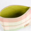 A bright green luxury leather alternative makeup kit with a pink picnic plaid  on the exterior 