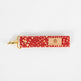 Bright and practical, this red fabric wristlet key clip features a playful dotted pattern and sleek gold-tone hardware.