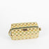 A stylish, upcycled toiletry bag featuring a classic checkered pattern, finished with a durable brown Unshattered brand label and high-quality construction.
