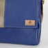 Blue leather bag with a 'Unshattered' brand label on a light gray background