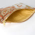 Decorative pouch with a patterned exterior and gold interior on a white background named after Sara