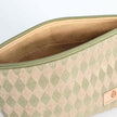 A tan luxury leather alternative interior on a beige and green diamond fabric on exterior makeup kit 