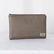 A large zip pouch in dark gray premium luxury leather alternative with a gold-tone hardware zipper, displayed against a white background.